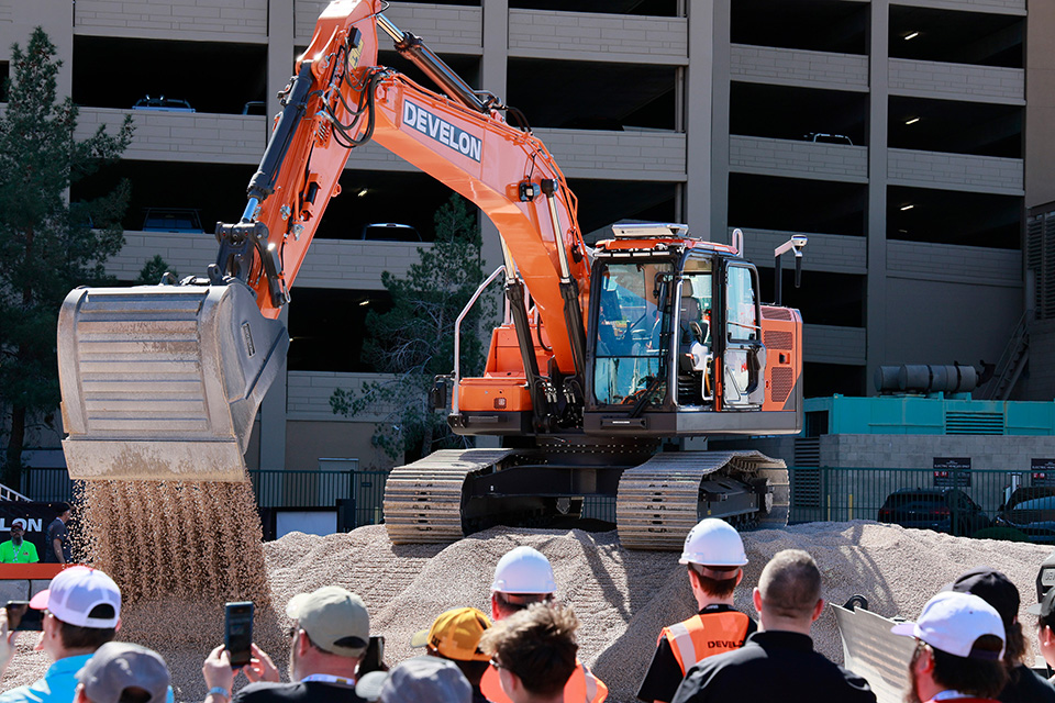 An unmanned autonomous excavator with an empty cab is being showcased at CONEXPO 2026, the North American construction equipment exhibition.