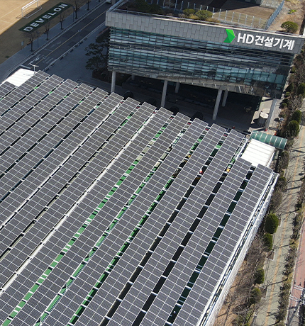 The HD Construction Equipment Incheon plant, powered by renewable energy, including solar power systems.